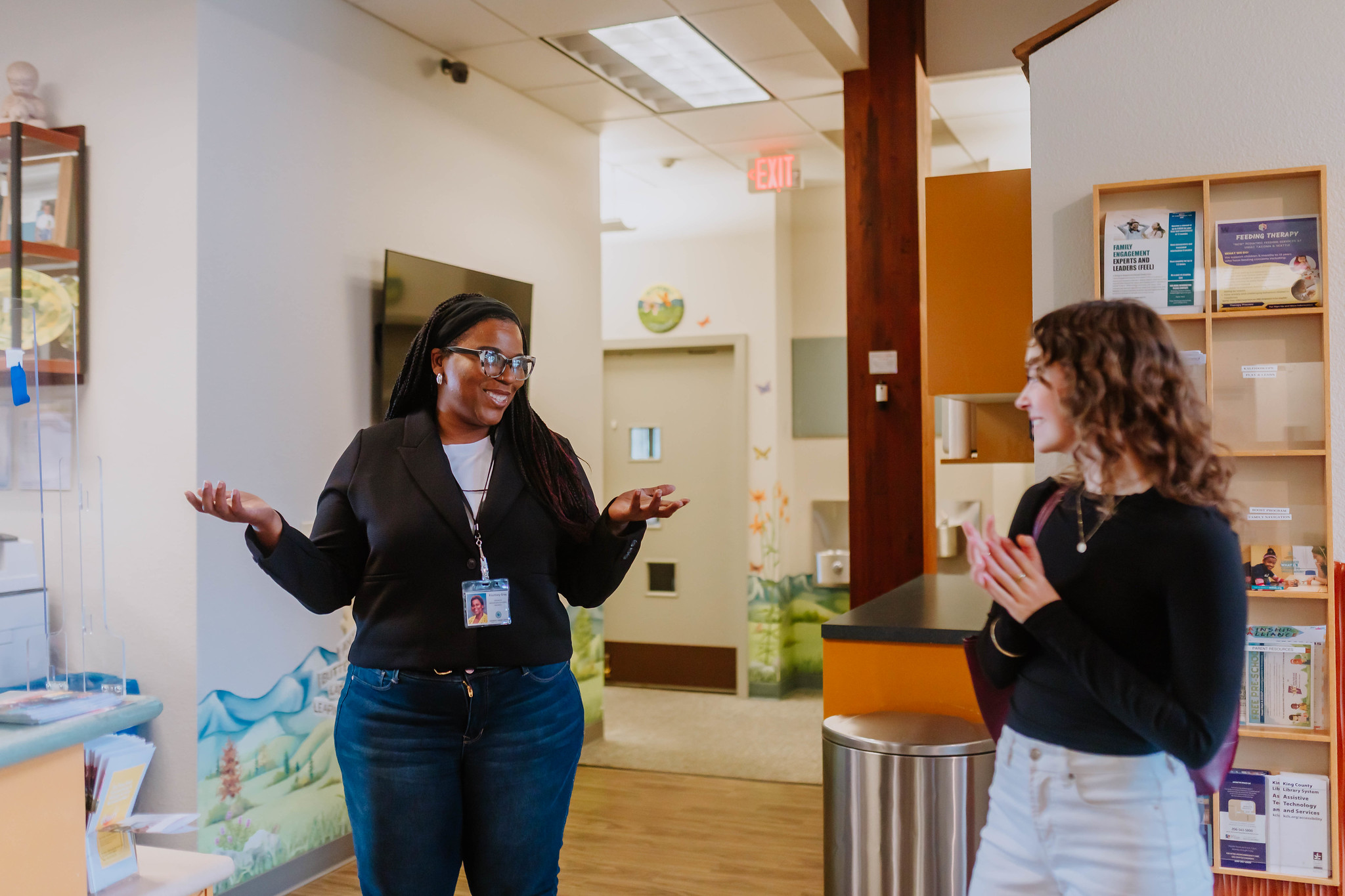 A Children's Therapy Center Kent Teammember providing a tour of a completed Capital Project investment site to King County staff member.